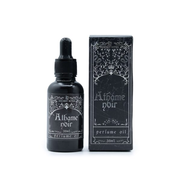 Frasco negro mate de aceite de perfume Athame Noir de 30 ml con cuentagotas junto a su caja ilustrada