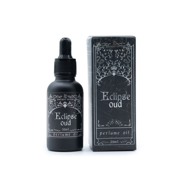 Frasco negro mate de aceite de perfume Eclipse Oud de 30 ml con cuentagotas y su caja negra ilustrada