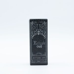 Frasco negro mate de aceite de perfume Eclipse Oud de 30 ml con cuentagotas y su caja negra ilustrada