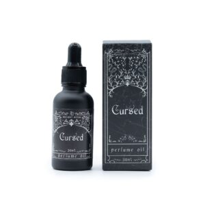 Frasco negro mate de aceite de perfume Maldito de 30 ml con cuentagotas junto a su caja negra ilustrada