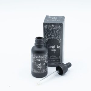 Frasco negro mate de aceite de perfume Perdido en el pecado de 30 ml con cuentagotas junto a su caja
