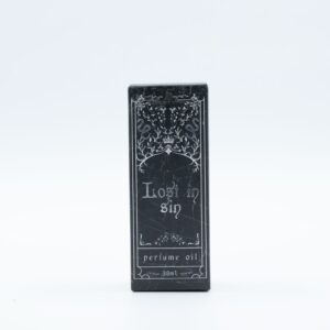 Frasco negro mate de aceite de perfume Perdido en el pecado de 30 ml con cuentagotas junto a su caja