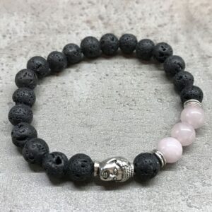 Pulsera elástica de cuentas de lava negra con una cabeza de Buda de tono plateado y cuentas de cuarzo rosa