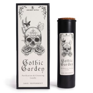 Vela ritual Jardín gótico en vaso negro junto a su caja ilustrada con una calavera entre rosas