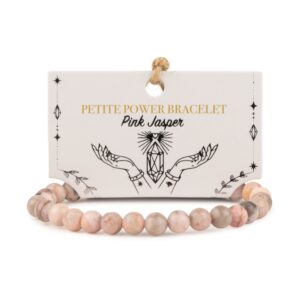 Pulsera elástica fina de cuentas de jaspe rosa con motas grises, vista de cerca