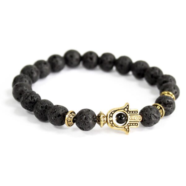 Pulsera elástica de cuentas de lava negra con una mano de Fátima de cobre en dorado envejecido y separadores dorados