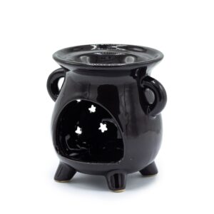 Quemador de aceite de cerámica negra con forma de caldero de tres patas y una luna creciente y estrellas caladas