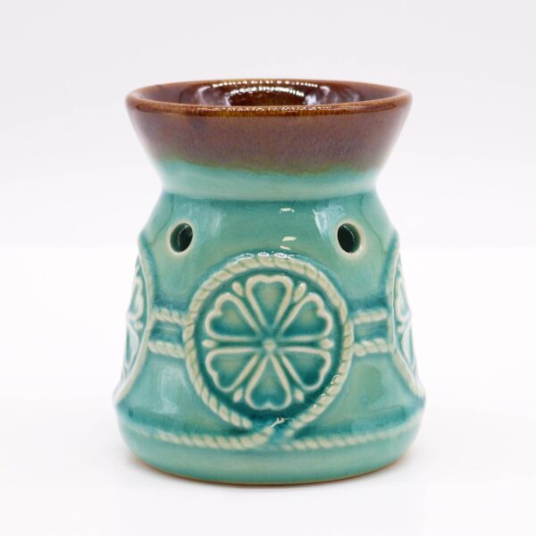 Quemador de aceite de cerámica turquesa craquelada con cazoleta marrón y medallón de flor en relieve