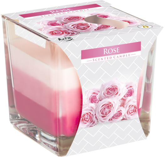 Vela de rosa en vaso cuadrado de vidrio con capas de cera rosa pálido, rosa y fucsia y faja con rosas