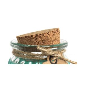 Vela de soja de color verde turquesa en tarro de cristal estriado con etiqueta kraft que dice Apple & Cinnamon