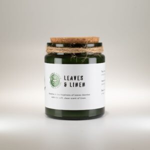 Vela de soja Leaves & Linen en tarro de vidrio verde con tapón de corcho y cordel al cuello