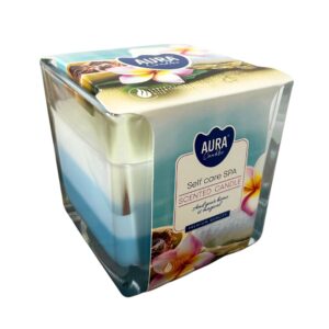 Vela Self care SPA en vaso cuadrado de vidrio con capas de cera blanca y azul y faja con flores de frangipani